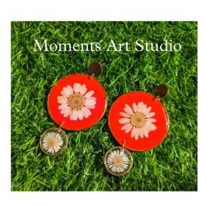 White Daisy Earrings in Red Background